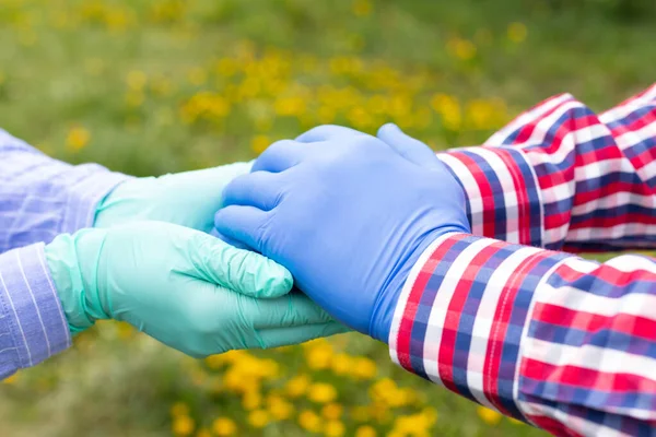 Holding Hands Wearing Gloves Because Covid Pandemic Caregiver Holding Elderly — Stock Photo, Image