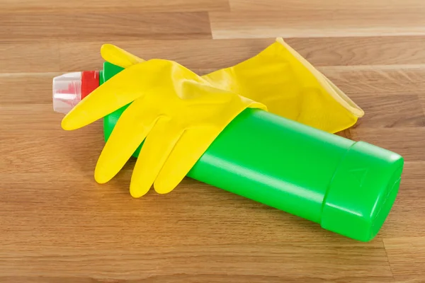 Picture of colorful cleaning supplies and tools on wooden background
