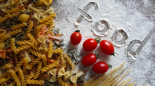 Food, Italian pasta, noodles, ingredients. Cooking. Cherry tomatoes, durum flour.