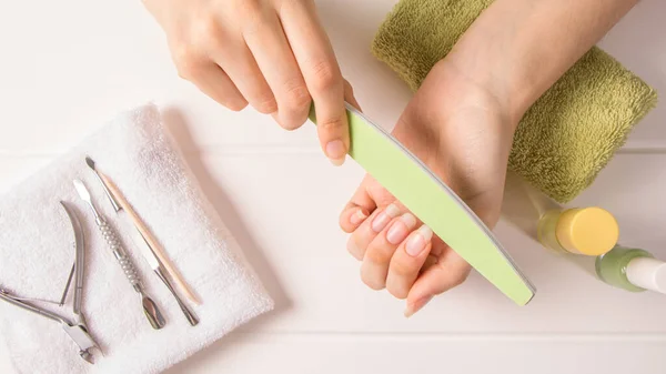 Manicure Woman Files Her Nails Shorten Long Nails Manicure Tools — стоковое фото