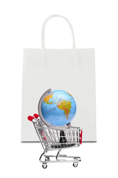 Earth on shopping cart with white paper bag — Stock Photo, Image