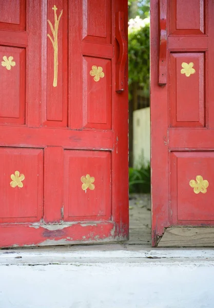 Old red wooden door open