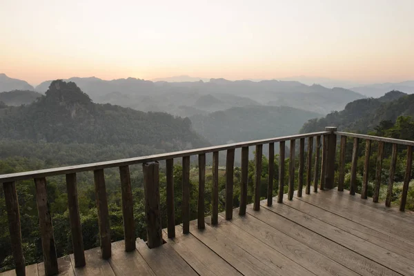Wooden terrace with the mountain landscape