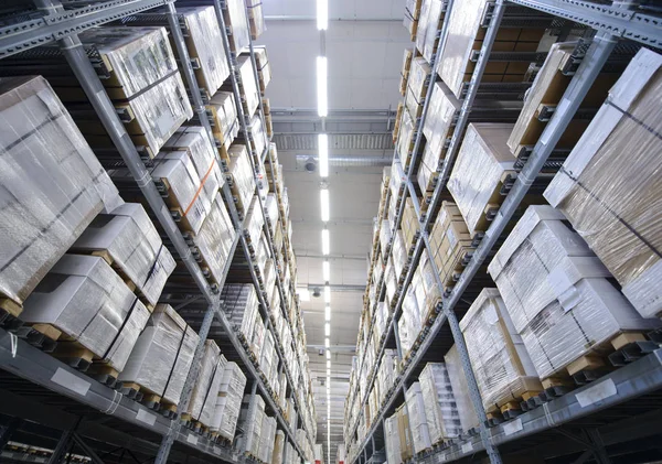 Rows of shelves with boxes in warehouse