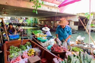 Bangkok, Thailand - January 26, 2020 : Thai traditional seller on boat at Khlong Lat Mayom floating market