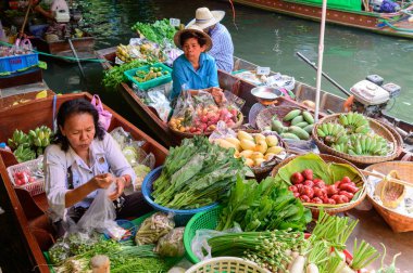 Bangkok, Thailand - January 26, 2020 : Fruit and vegetable vendors on boats at Khlong Lat Mayom floating market