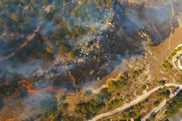 Steppe fire. Burning dry grass, fire smoke