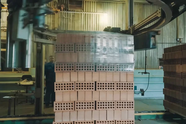 Wrapping a transport film of a brick pallet. Brick production, h