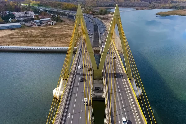 Beautiful bridge over the river. The bridge on the cables is road.