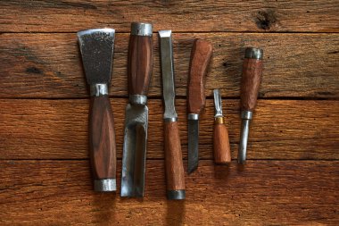 six chisels  a wooden table clipart
