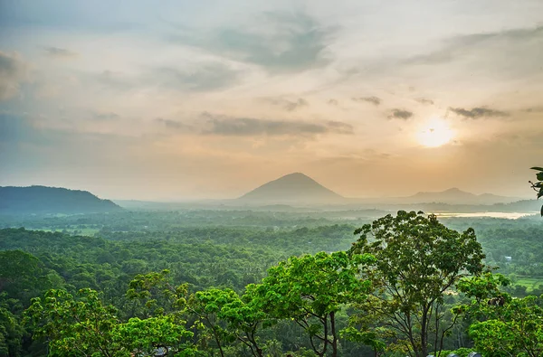 The foggy sunset in Dambulla