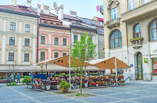 LVOV, UKRAINE - MAY 16, 2017: The lovely outdoor cafe in Yavorskoho square in Old Town, on May 16 in Lvov.