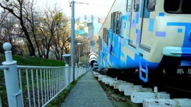 KYIV, UKRAINE - APRIL 14, 2018: The Funicular wagons ride on Volodymyrska Hill, located between lower and upper city and occupied with lush green garden, on April 14 in Kyiv. 