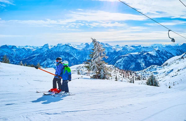 Kids on button ski lift, Feuerkogel Mountain, Ebensee, Salzkamme