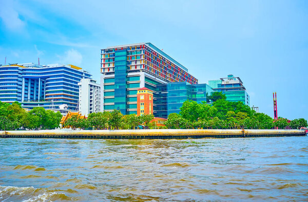 The modern building on the bank of Chao Phraya river in Bangkok,