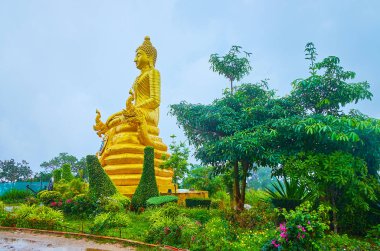 Golden image in garden, Big Buddha Temple, Chalong, Phuket, Thai