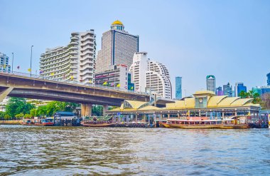 Taksin Bridge with surrounding buildings, Bangkok, Thailand clipart