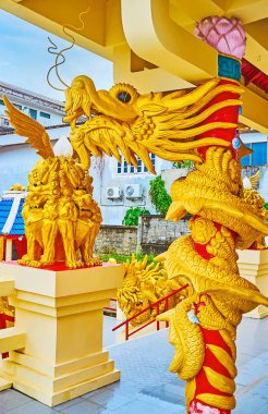 The golden dragon in Sam Sae Chu Hut Chinese Shrine, Phuket City clipart