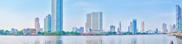 The modern Bangkok on the banks of Chao Phraya river, Thailand