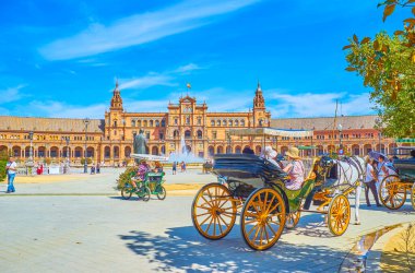 The tourist carriages on Plaza de Espana in Seville, Spain