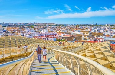 Walk on footbrige of Metropol Parasol in Seville, Spain