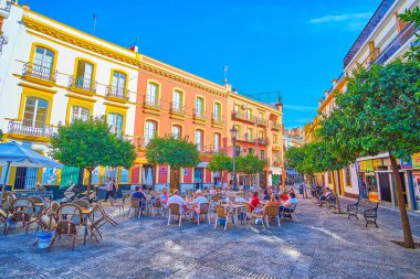The small square with outdoor cafes, Seville, Spain