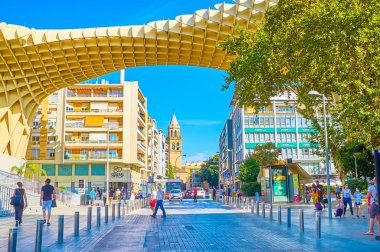 The busy street under Metropol Parasol construction in Seville,  clipart