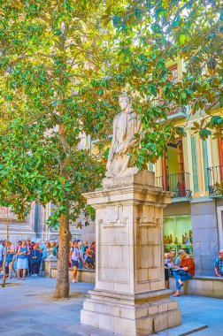 GRANADA, SPAIN - SEPTEMBER 27, 2019: The stone statue of the famous Spanish painter and sculptor Alonso Cano, located in the square of his name, on September 27 in Granada