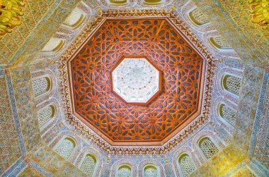 GRANADA, SPAIN - SEPTEMBER 27, 2019: Splendid dome in mosque of Palacio de la Madraza (Madrasah) with stellar pattern, arabesques, mocarabe (muqarnas) and Islamic patterns, on September 27 in Granada
