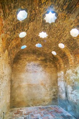 GRANADA, SPAIN - SEPTEMBER 25, 2019: The cold room (bayt al-barid) of El Banuelo (Arab Baths, hammam) with stellar and octagonal shaped light holes in vault, on September 25 in Granada