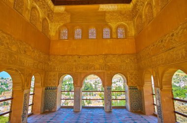 GRANADA, SPAIN - SEPTEMBER 25, 2019: Interior of Partal Palace of Alhambra with remains of complex tilling, plasterwork, sebka, fine Islamic patterns and windows with Arabic screens, on September 25 in Granada clipart