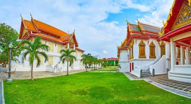 Panorama of Wat Benchamabophit Dusitvanaram Marble Temple complex with building of Song Tham throne hall and Four Princess pavilion, Bangkok, Thailand clipart