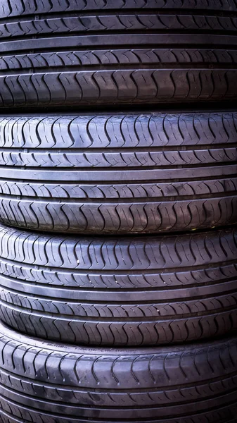 Set of summer car tires isolated. Tire stack background. Car tyr