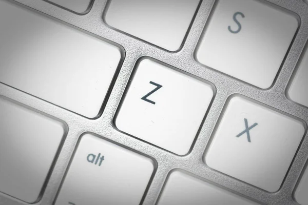 Computer keyboard - silver keyboard of a laptop with button Z is — Stock Photo, Image