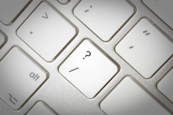 Computer keyboard - silver keyboard of a laptop with button Ques — Stock Photo, Image