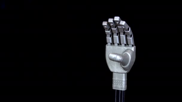 En mekanisk arm spänner fingrarna. Grå cyborg arm kom till liv och började röra sig på en svart bakgrund. — Stockvideo