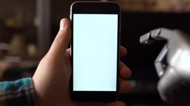 Cyborg uses the phone. Gray mechanical hand swipe up on smartphone with white screen. Template. — Stock Video