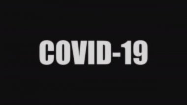 COVID-19 kelimesi ortaya çıkar ve bir hata yapar. Bozuk bir monitörün ekranı. Hareket grafikleri.