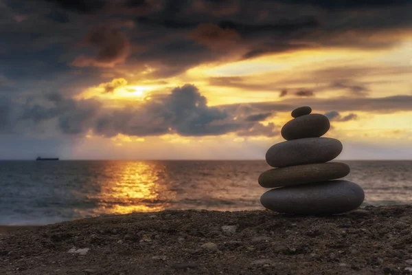 Stack of zen stones at sunset — Stock Photo, Image