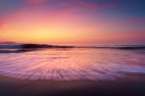 Sunset on beach shore — Stock Photo, Image