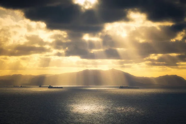 Sun rays on the sea with ships — Stock Photo, Image