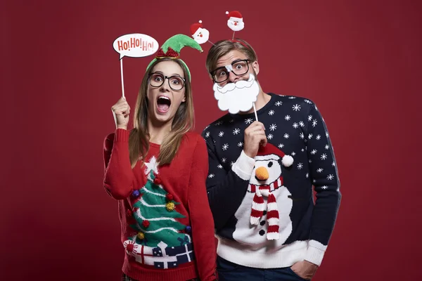 Couple with funny christmas masks — Stock Photo, Image