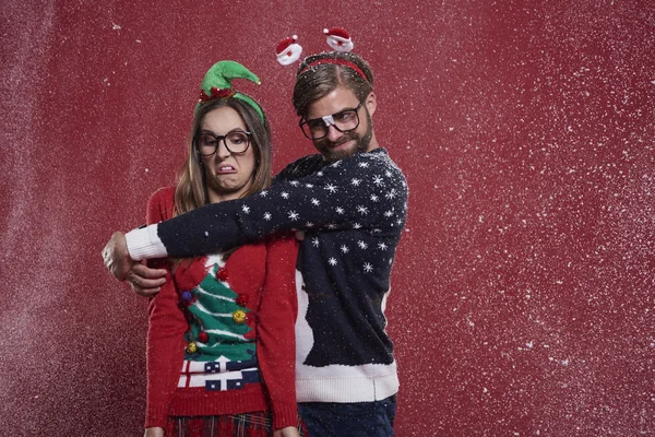 Couple of nerd in christmas sweaters — Stock Photo, Image