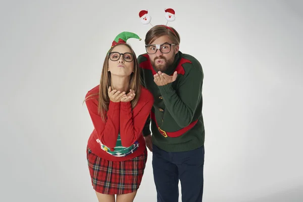 People in colorful christmas jumpers in funny holiday concept — Stock fotografie