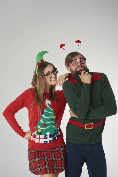 People in colorful christmas jumpers in funny holiday concept — Stock Photo, Image