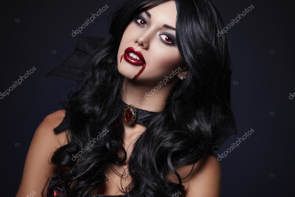 Magical woman vampire with blood on lips — Stock Photo © gpointstudio