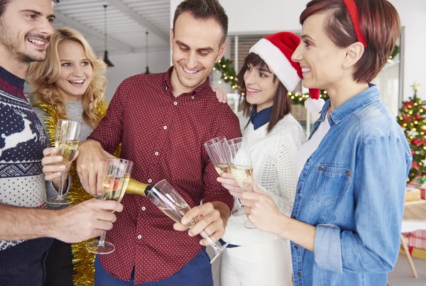 Happy colleagues having one more toast — ストック写真