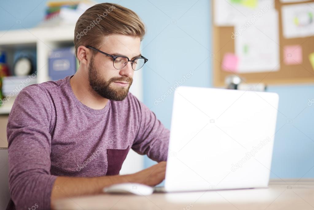  young handsome man working at home