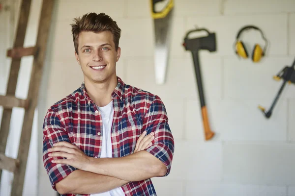 Young carpenter at building object — Stock Photo, Image