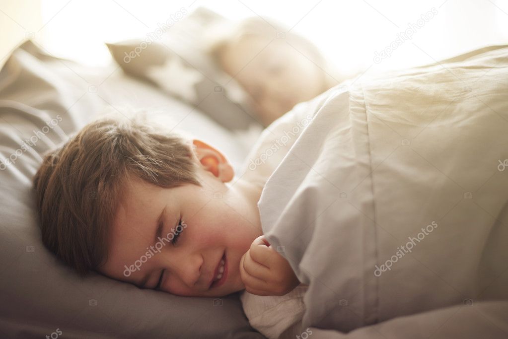 children dreaming in their bed